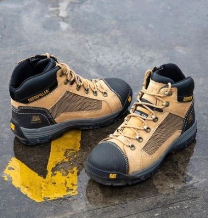 CAT Convex ST Mid Boots on the ground for a product shot 
