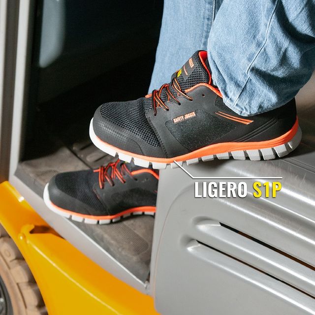 A man sitting on a forklift wearing a Safety Jogger Ligero 1 Shoes 