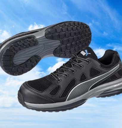 A pair of Pursuit FT Safety Shoes - Black are shown with a sky background
