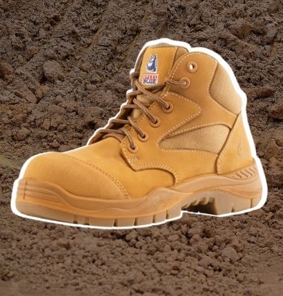 Boot with white highlight on dirt background 