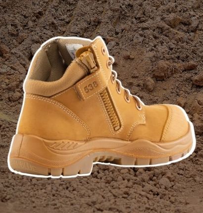 Boot with white highlight on dirt background 