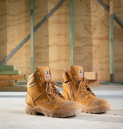 Steel Blue Southern Cross Zip TPU Boots angled for the nice picture in a workshop