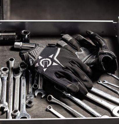 UNIT Flex Guard Gloves laying in a tool chest. 