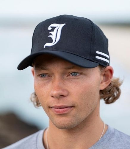 Young man wearing the JetPilot Times Cap 