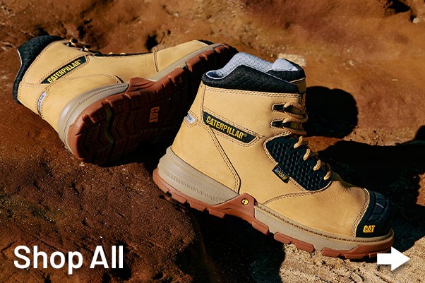 Men's CAT Workwear Tradie boots on rocks in Australian heat.