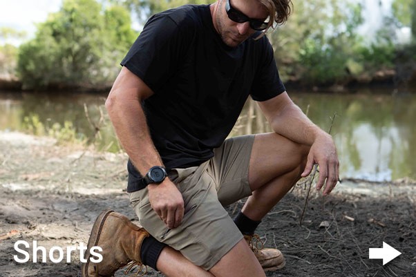 Man kneeling down in outback wearing Jetpilot Workwear tradie clothing.