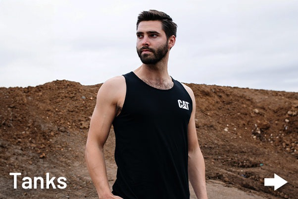 Aussie Tradie Man wearing CAT Workwear tank on Australian Construction site.