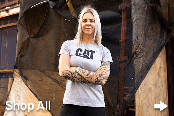 Women Tradie wearing grey CAT Workwear shirt onsite in AUstralia