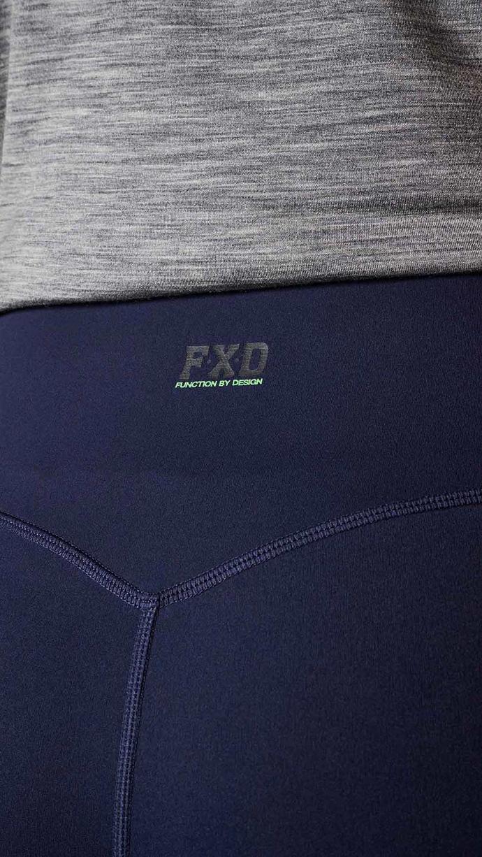 Tradie Women wearing FXD WP-9W Women's Stretch Work Leggings in navy