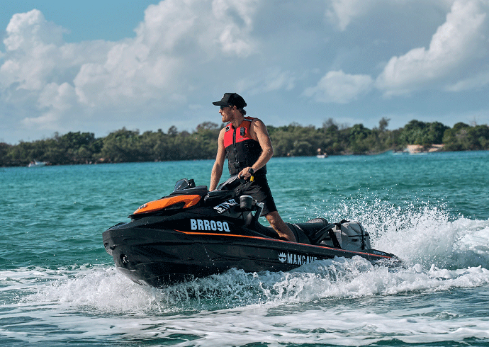 Win this Jet Ski! Tradie man riding jet ski in Australian ocean for Jet Ski giveaway.